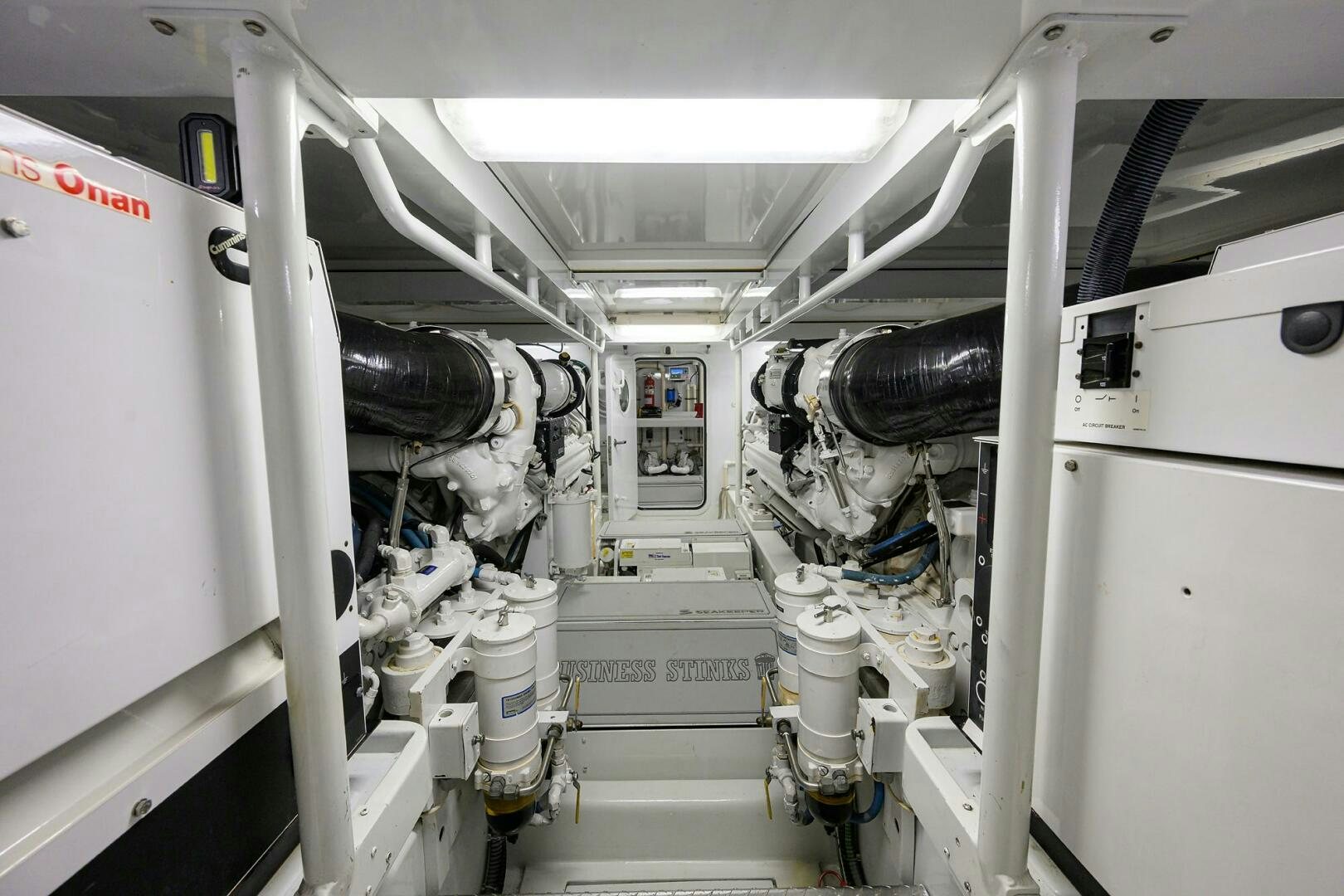 a person working in a machine aboard BUSINESS STINKS Yacht for Sale