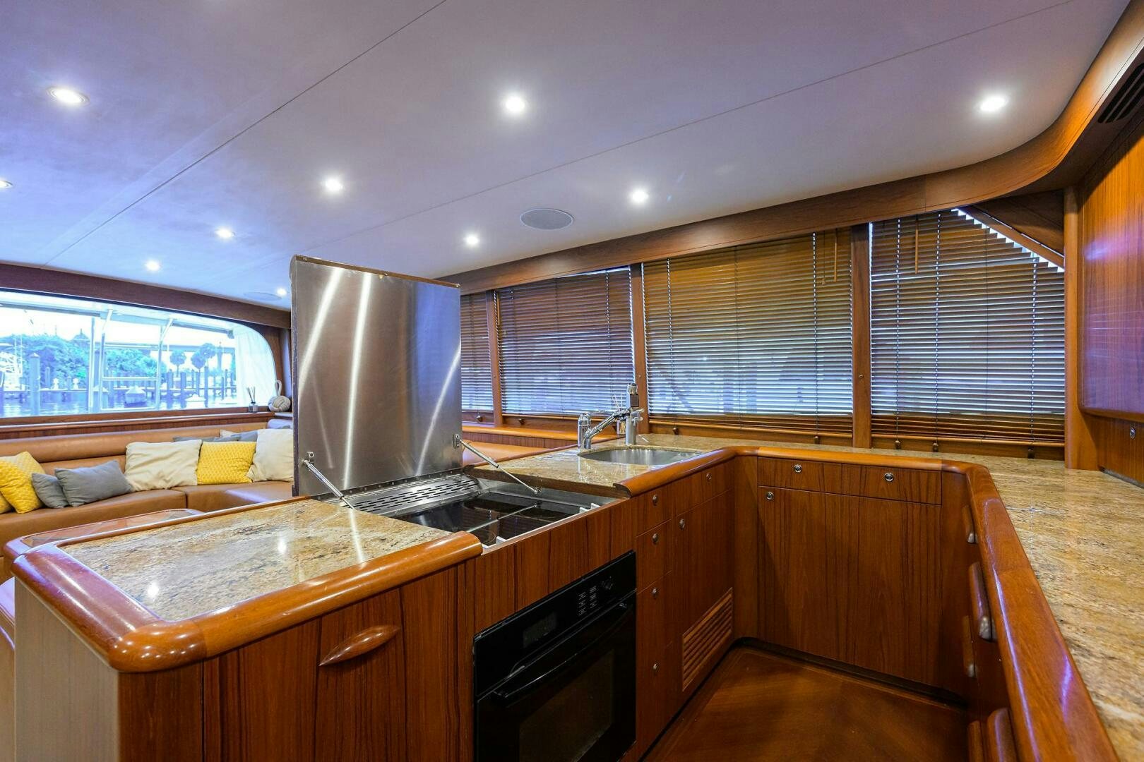 a kitchen with a large island aboard BUSINESS STINKS Yacht for Sale