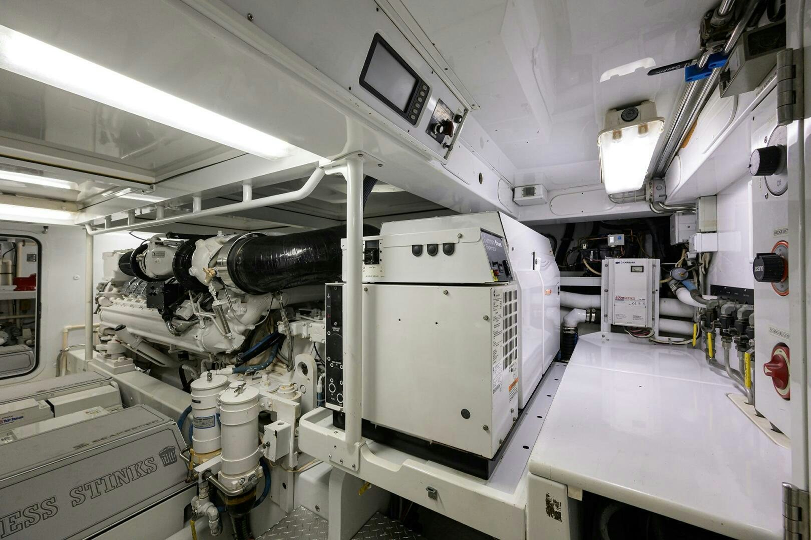 a large white machine in a room aboard BUSINESS STINKS Yacht for Sale