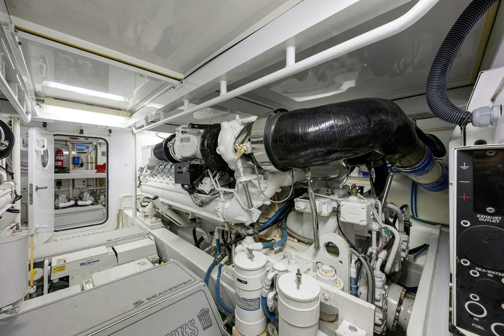 a car with a large engine aboard BUSINESS STINKS Yacht for Sale