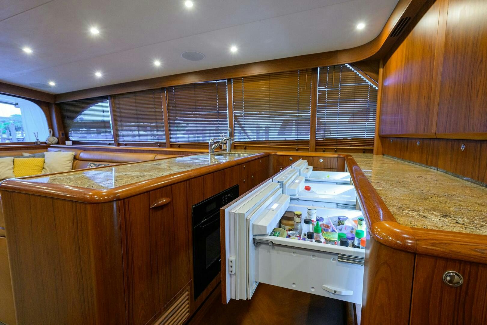 a kitchen with a large window aboard BUSINESS STINKS Yacht for Sale