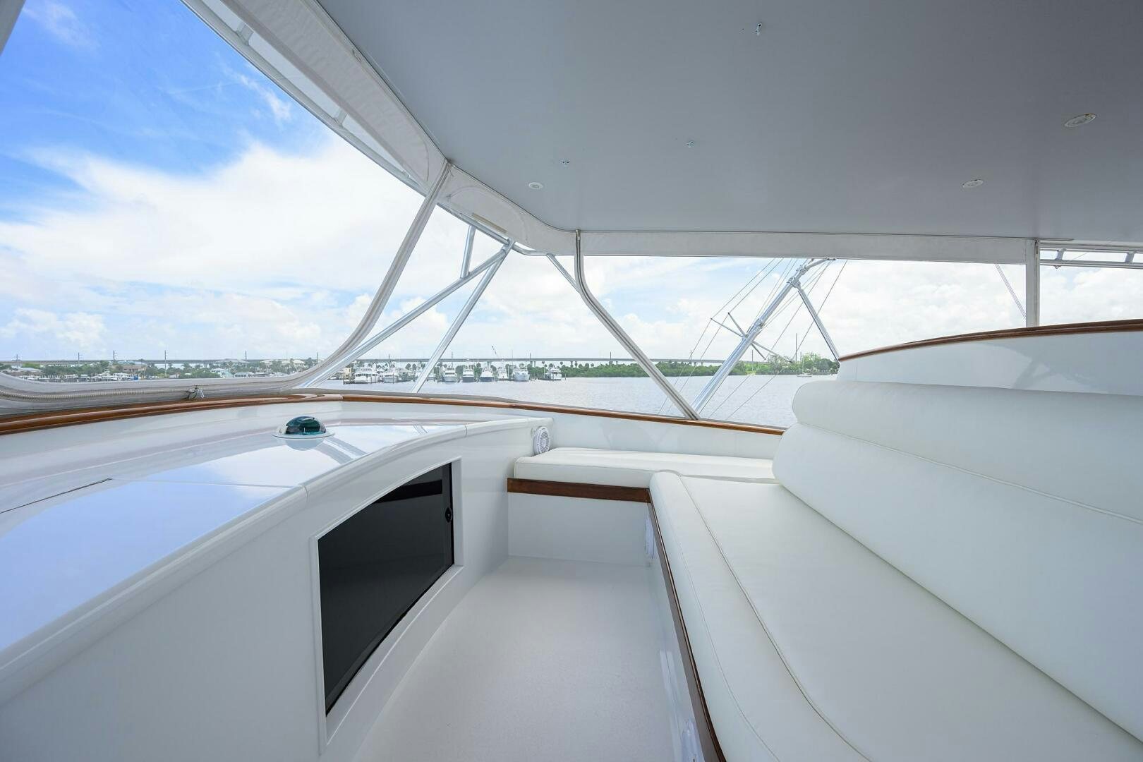 a view of the inside of a white car with a view of the city below aboard BUSINESS STINKS Yacht for Sale