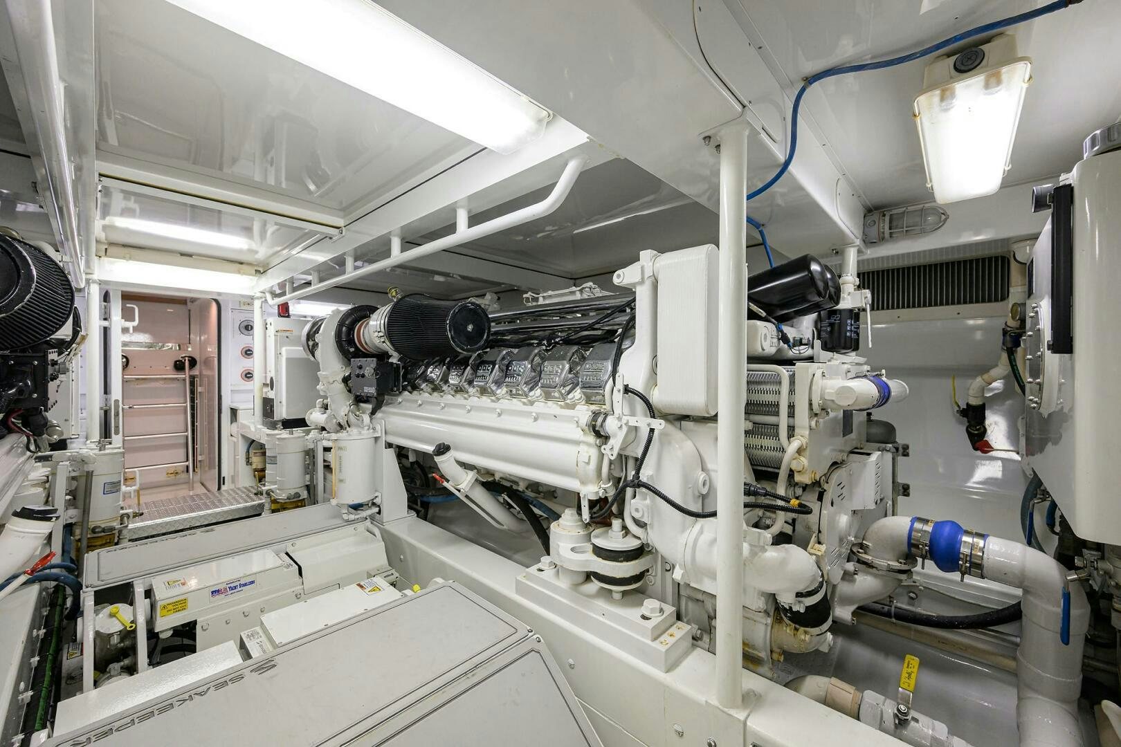 a large white machine with a blue light aboard BUSINESS STINKS Yacht for Sale