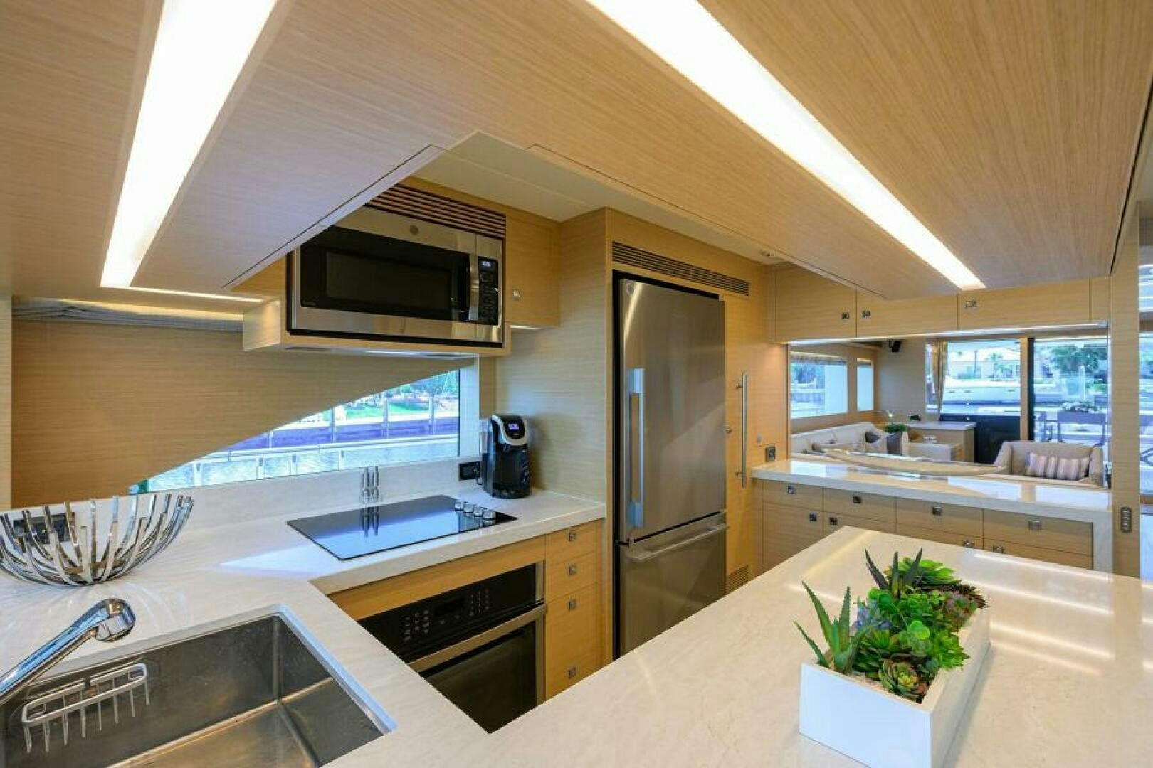 a kitchen with a large island aboard JOURNEY Yacht for Sale