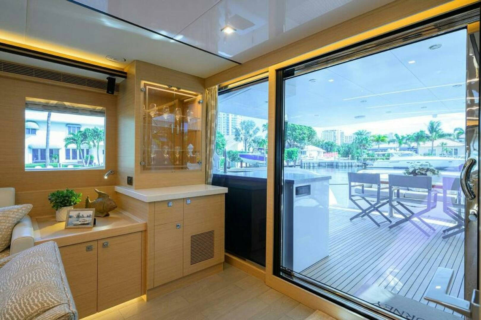 a room with a large window and a view of the city aboard JOURNEY Yacht for Sale