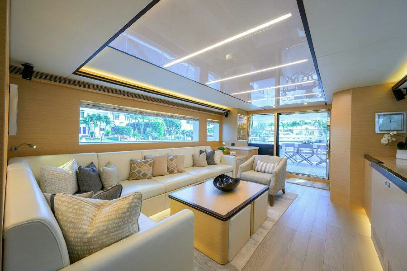 a living room with a large window aboard JOURNEY Yacht for Sale