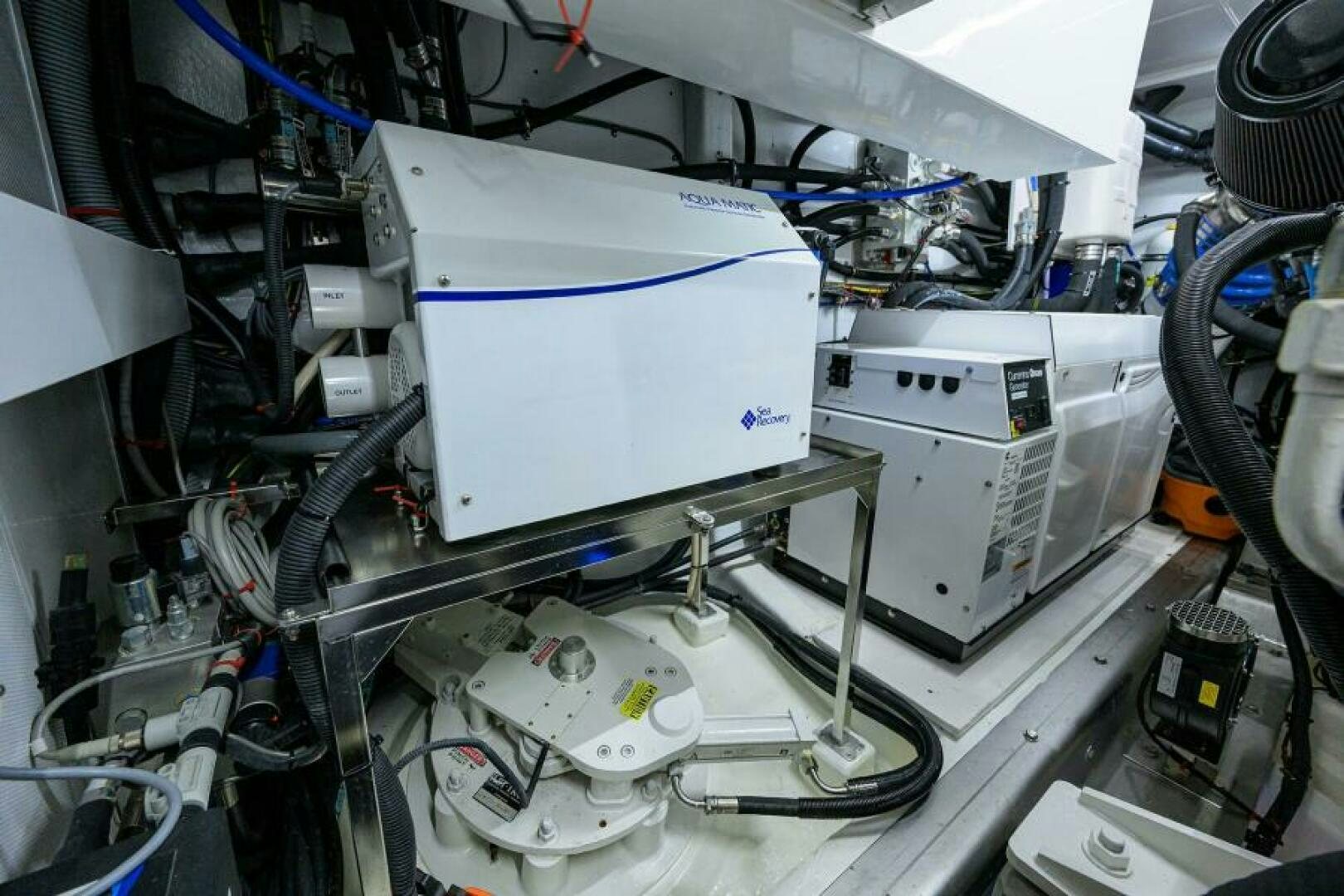 a white machine with a blue and white object on it aboard JOURNEY Yacht for Sale