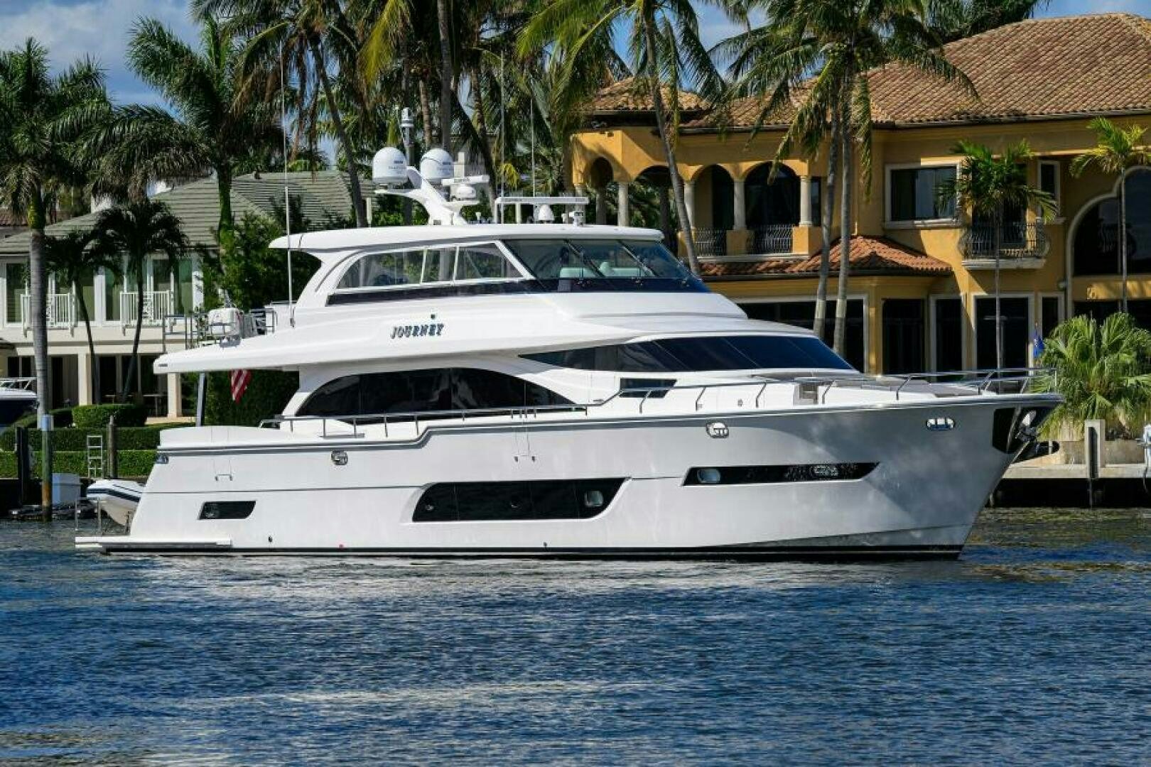 a white yacht in the water aboard JOURNEY Yacht for Sale