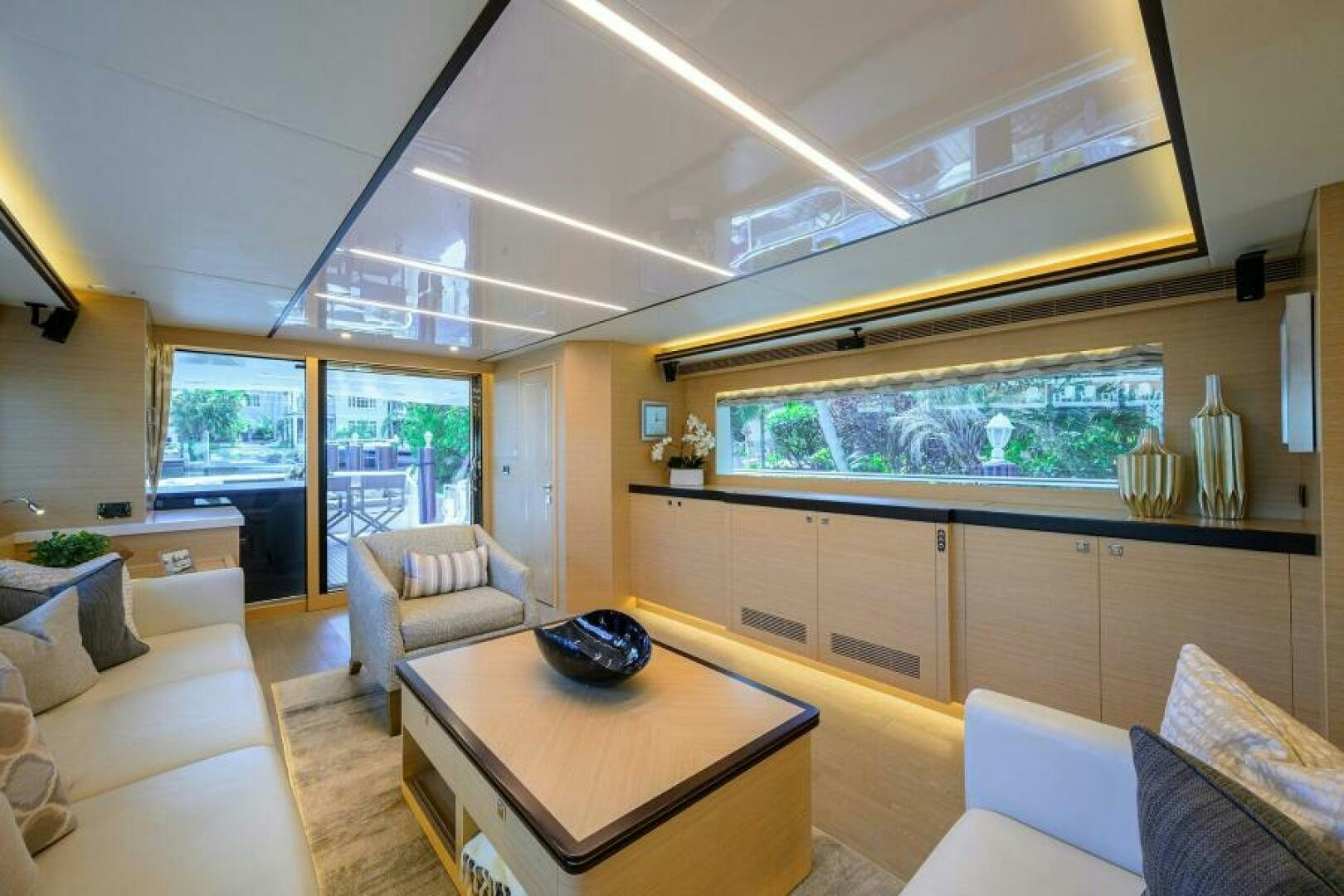 a living room with a large window aboard JOURNEY Yacht for Sale