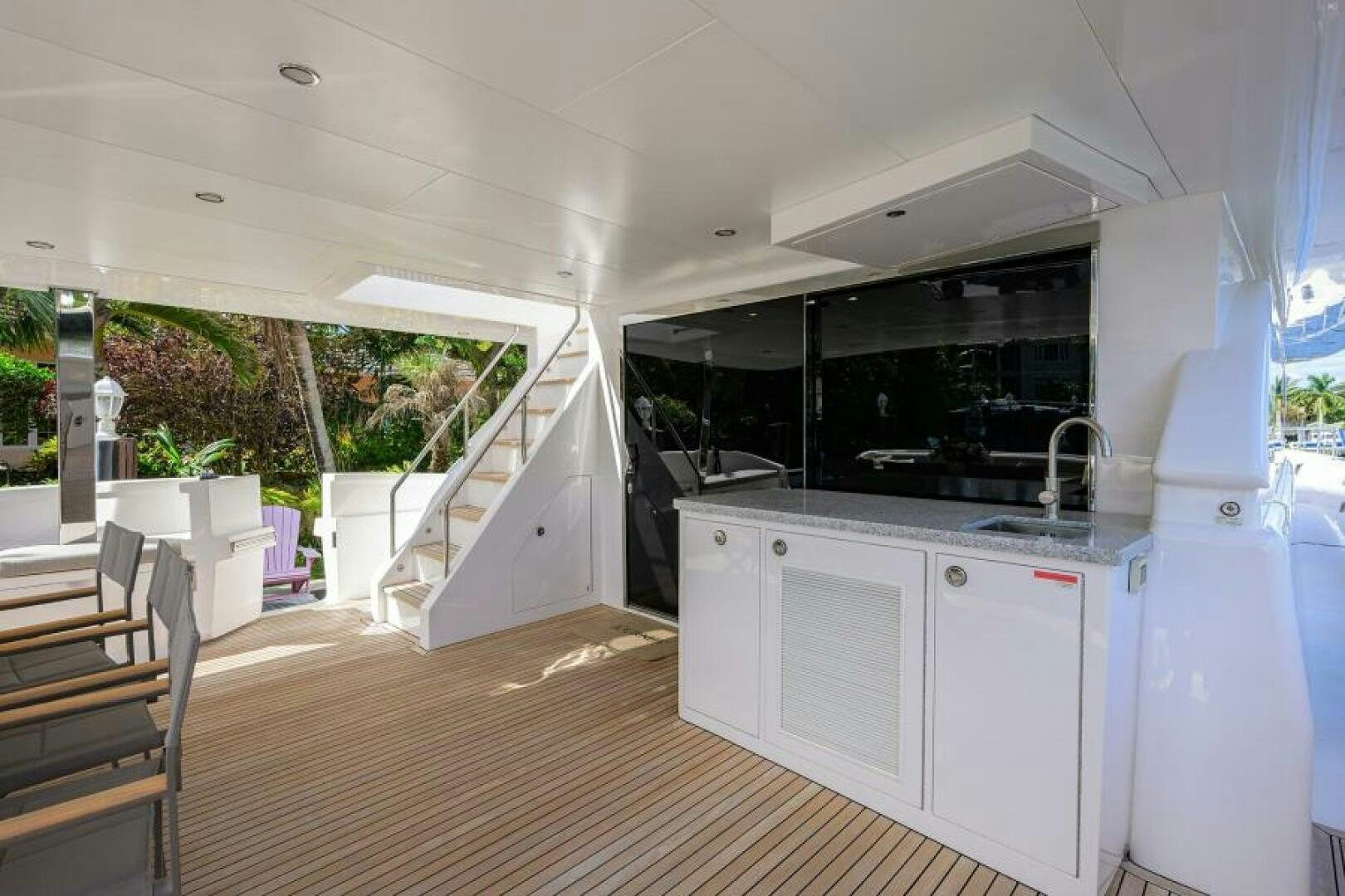a kitchen with white cabinets aboard JOURNEY Yacht for Sale