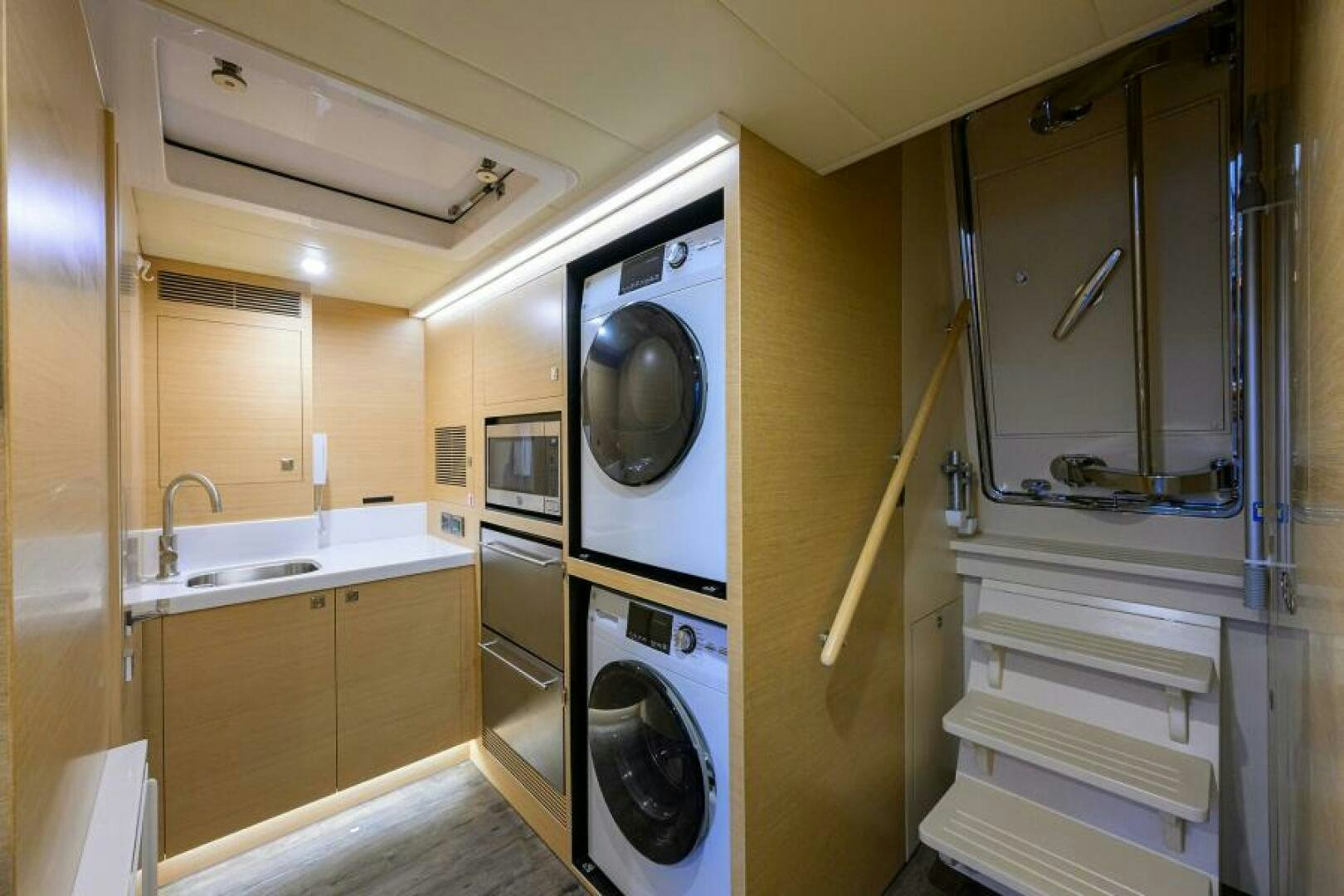 a washer and dryer in a room aboard JOURNEY Yacht for Sale