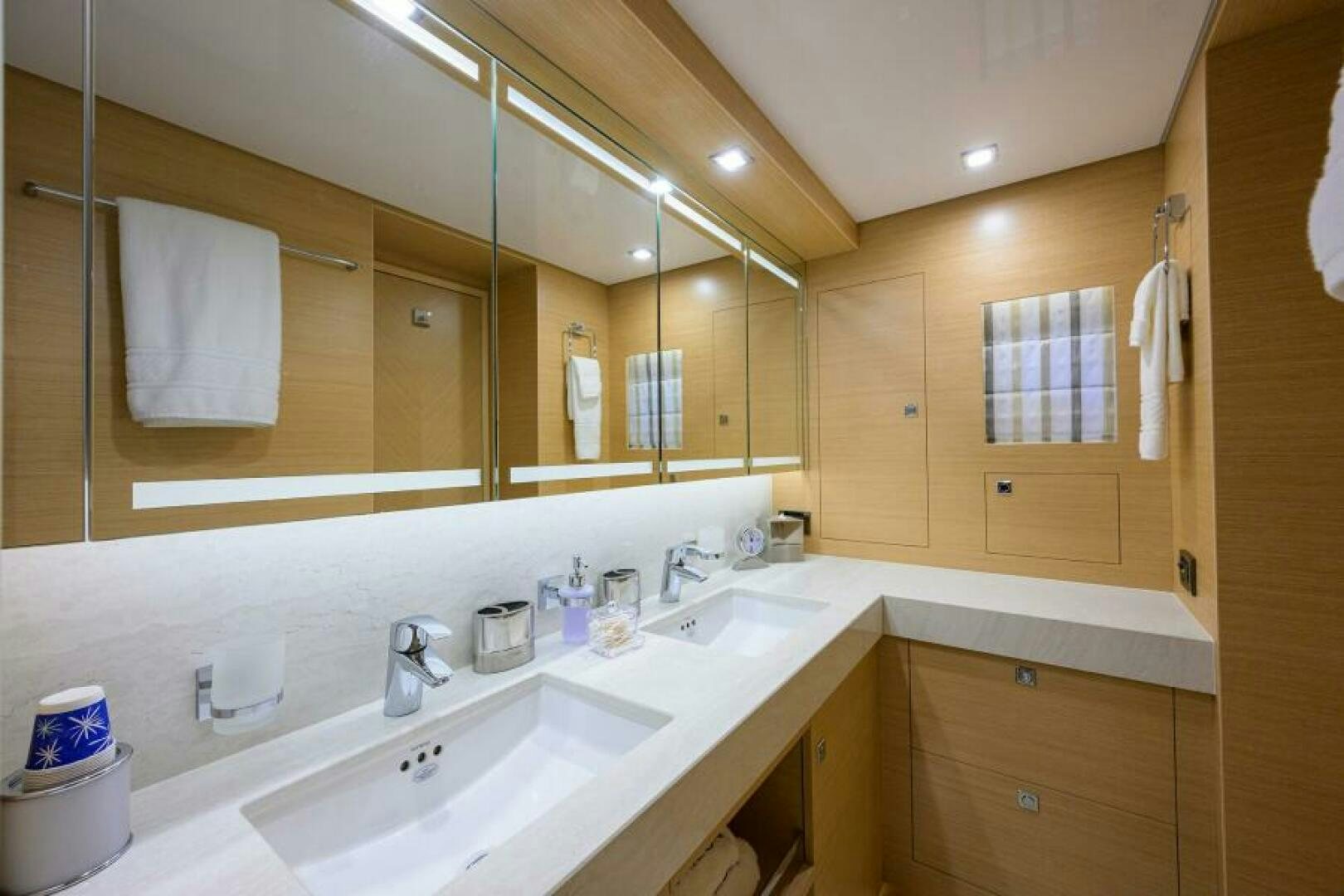 a bathroom with a large mirror aboard JOURNEY Yacht for Sale