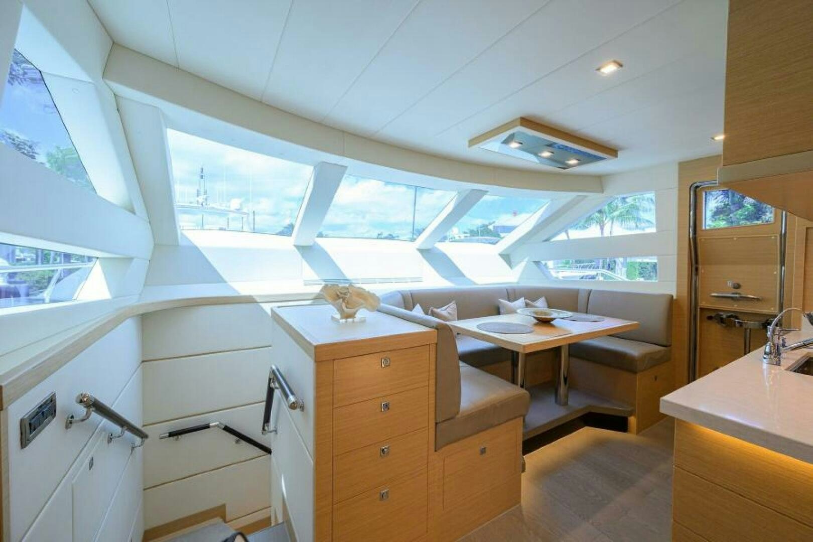 a room with a desk and a window aboard JOURNEY Yacht for Sale