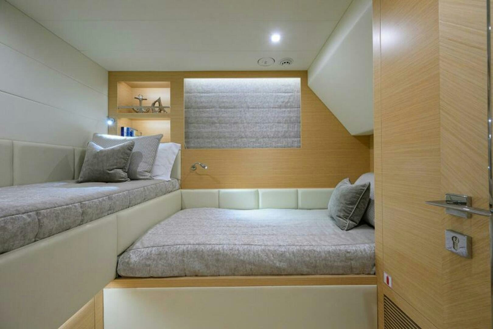 a couple of beds in a room aboard JOURNEY Yacht for Sale