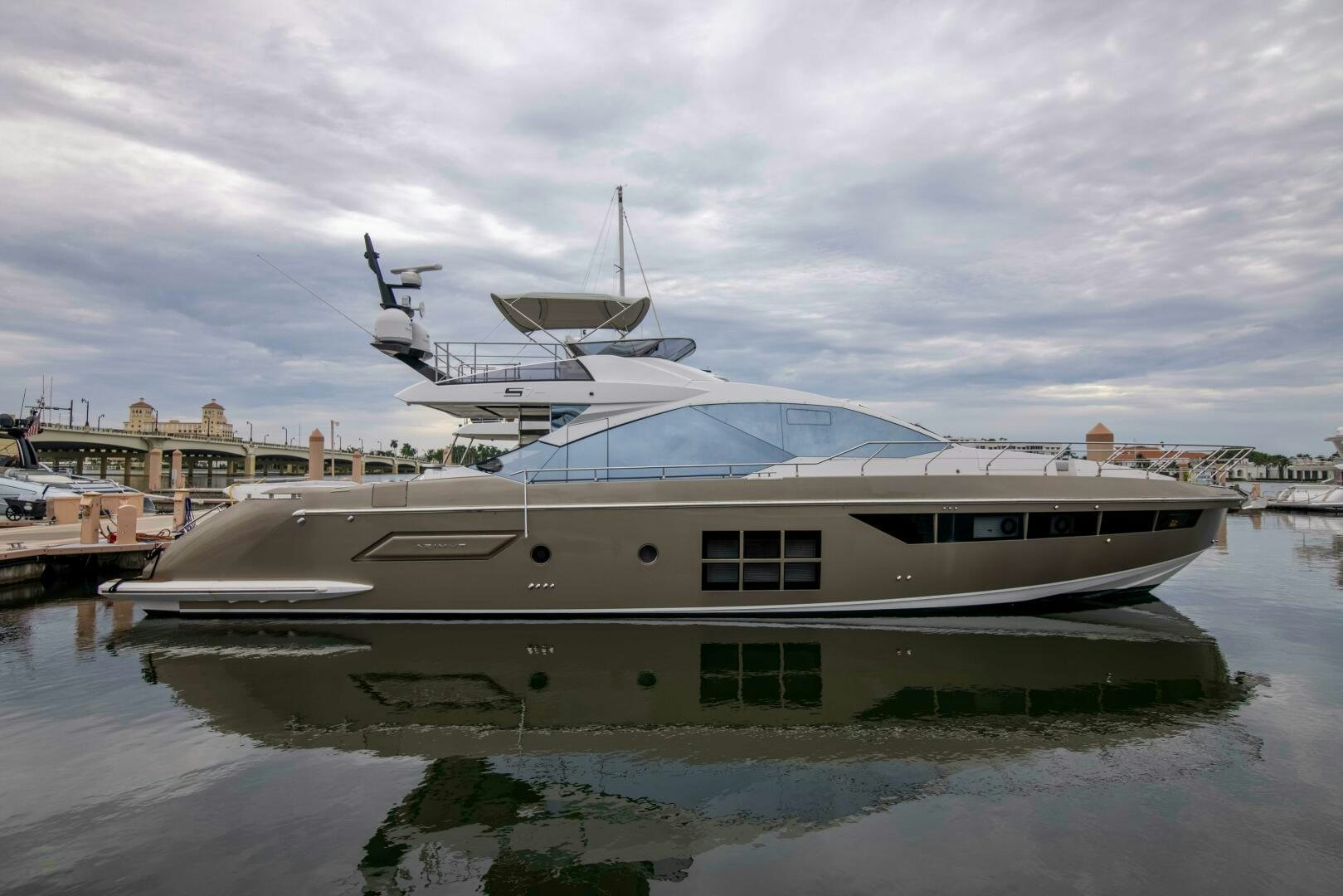 a large white yacht docked aboard TRIPLE PLAY Yacht for Sale