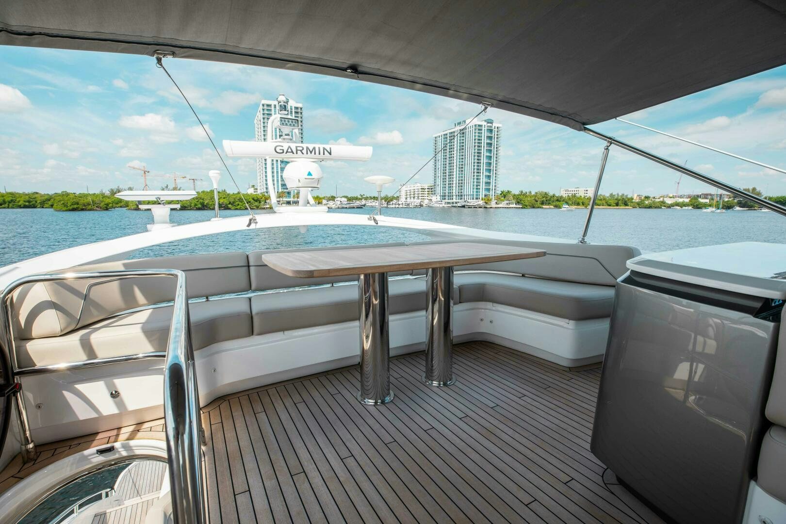 a deck with a table and chairs on it aboard BEST OF YOU Yacht for Sale