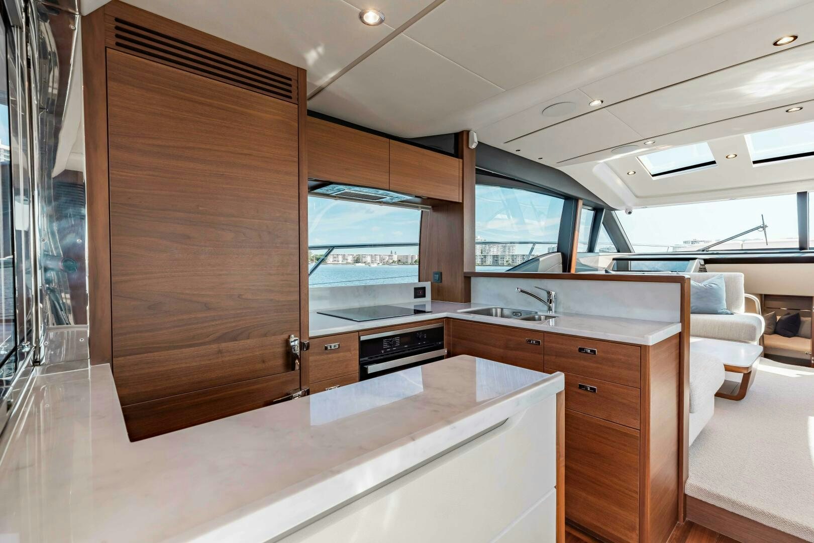a kitchen with a large wooden cabinet aboard BEST OF YOU Yacht for Sale