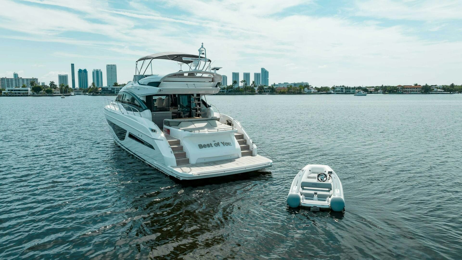 a boat and a car on the water aboard BEST OF YOU Yacht for Sale