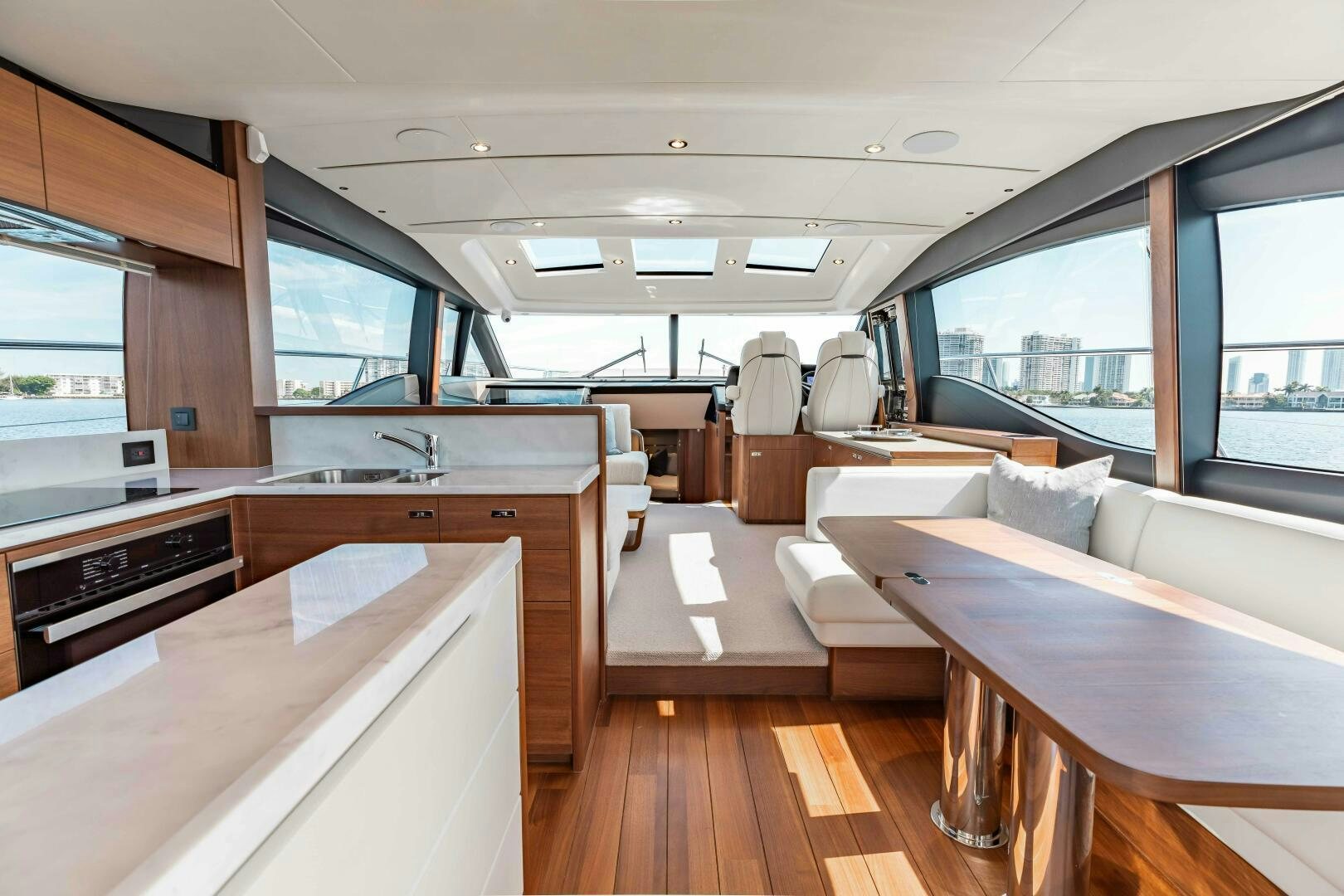 a room with a large window and a wood floor aboard BEST OF YOU Yacht for Sale