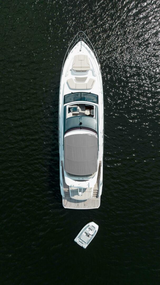 a white boat on water aboard BEST OF YOU Yacht for Sale