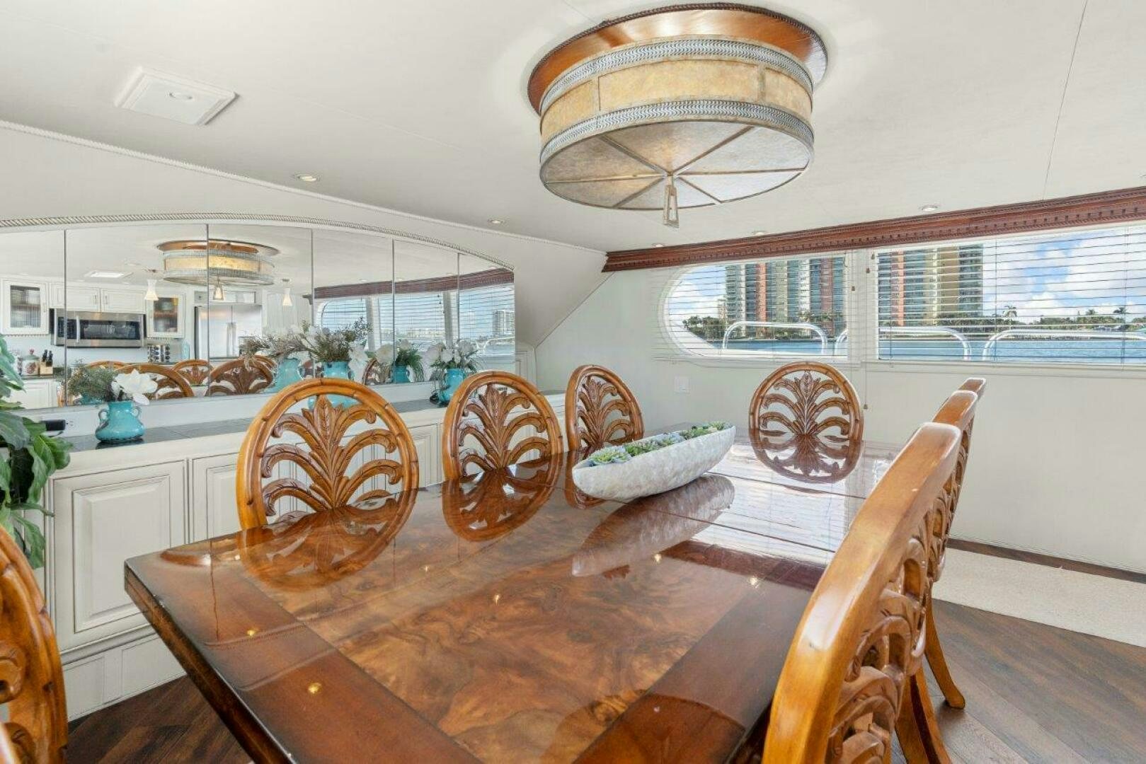a dining table in a kitchen aboard ENVISION Yacht for Sale
