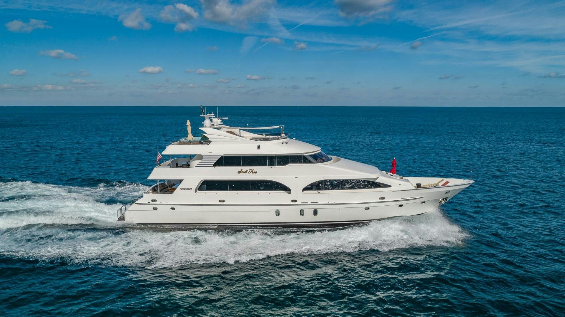 a white yacht on the water aboard SCOTT FREE Yacht for Sale