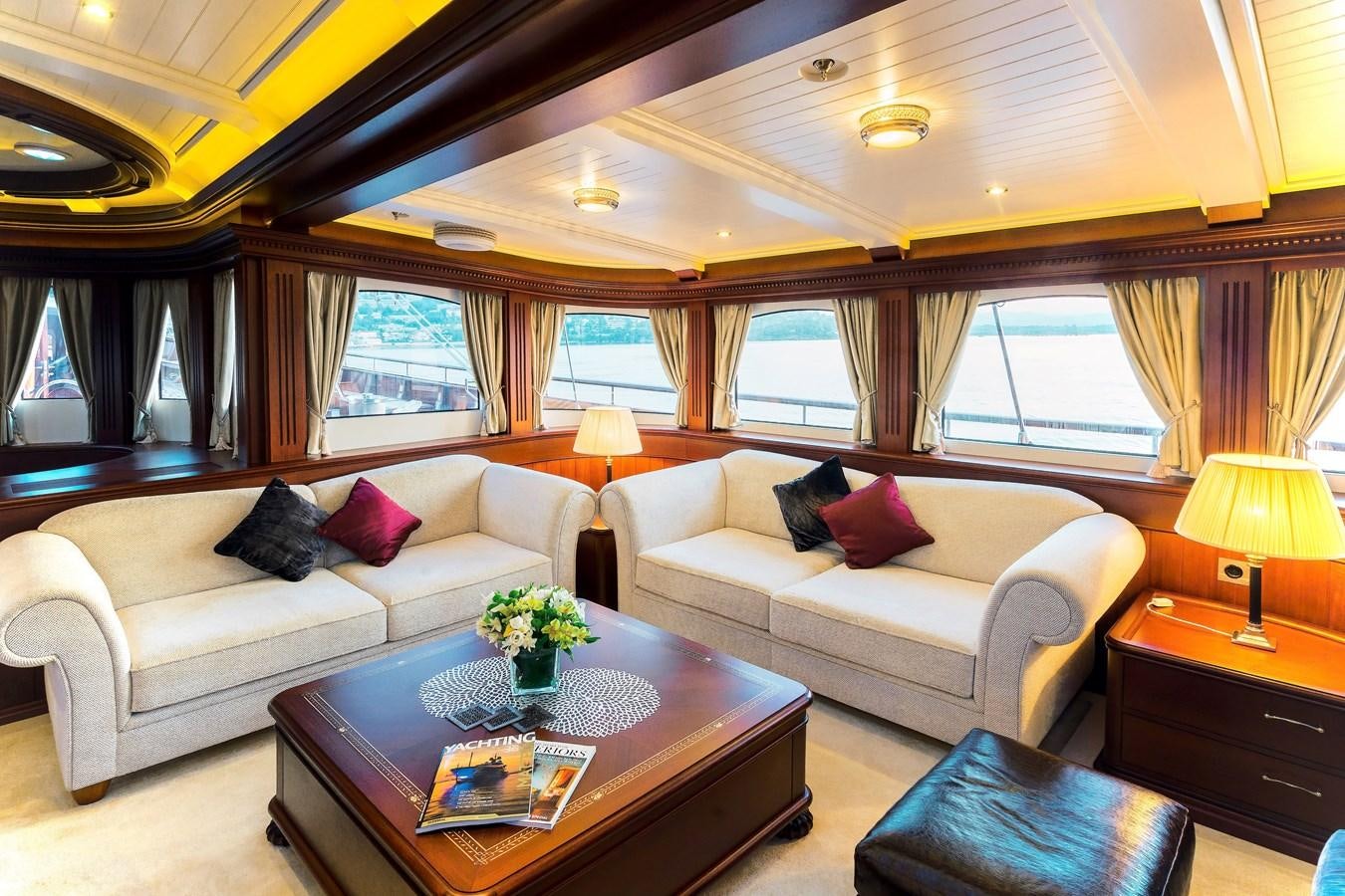 a living room with a couch and a coffee table aboard MIKHAIL S. VORONTSOV Yacht for Sale