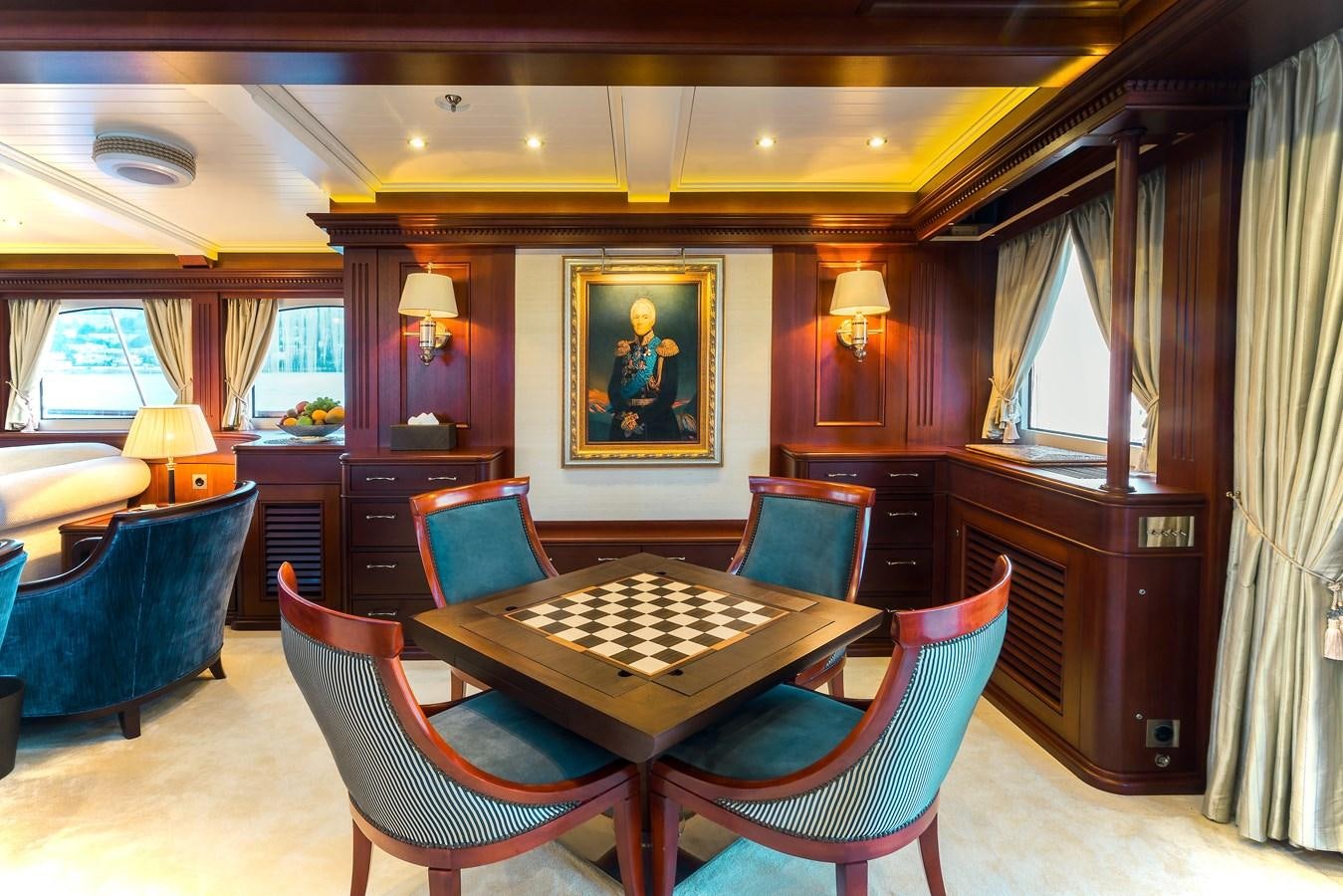 a large room with a pool table and chairs aboard MIKHAIL S. VORONTSOV Yacht for Sale