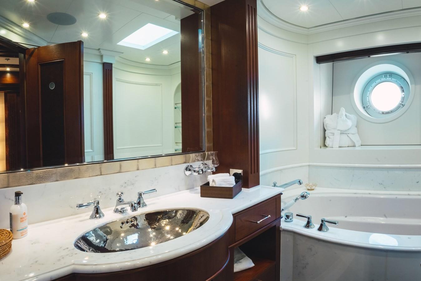 a bathroom with a large mirror aboard MIKHAIL S. VORONTSOV Yacht for Sale