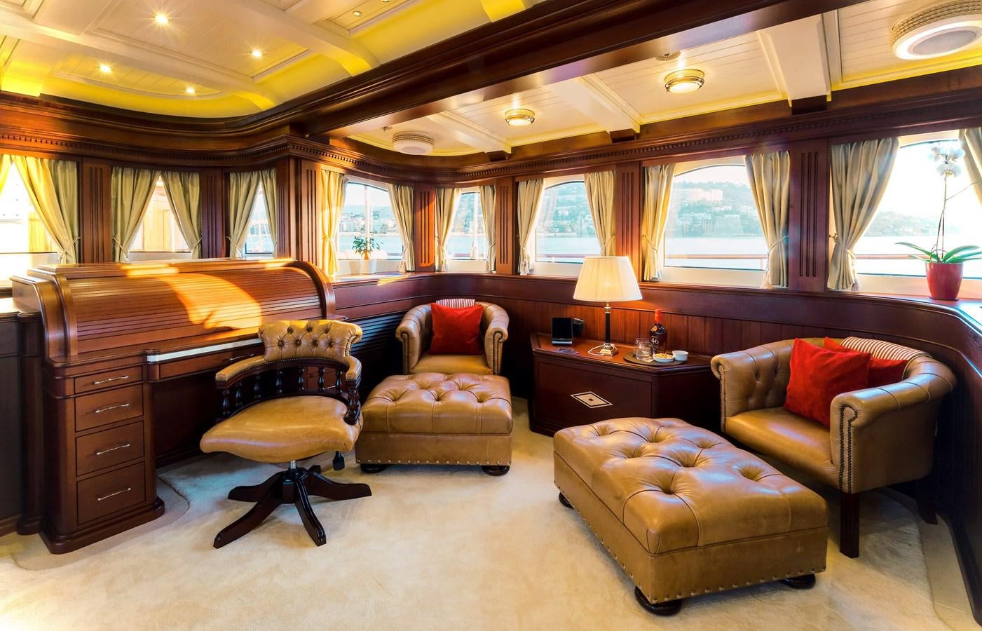 a living room with a couch and a coffee table aboard MIKHAIL S. VORONTSOV Yacht for Sale