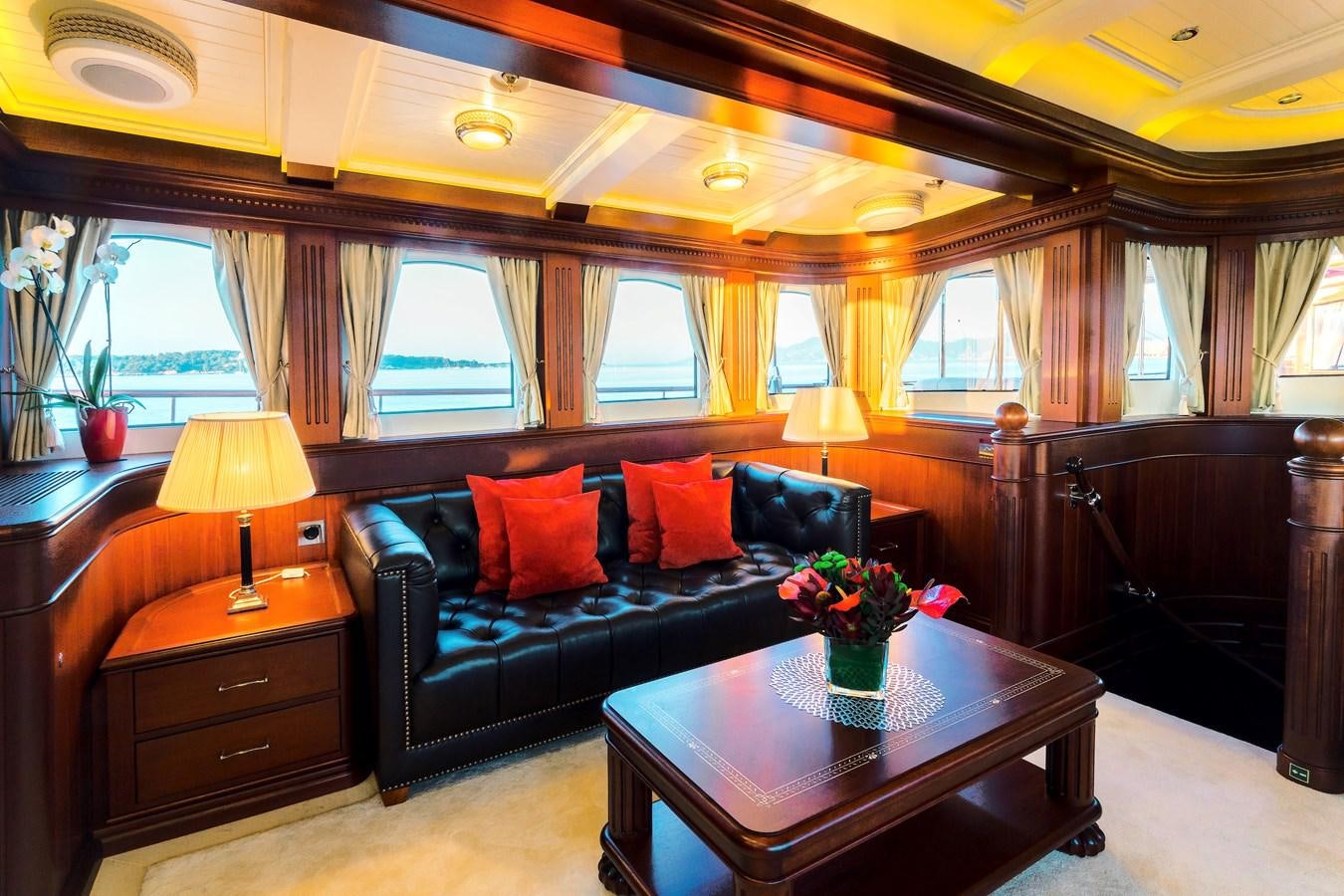 a living room with a black couch aboard MIKHAIL S. VORONTSOV Yacht for Sale