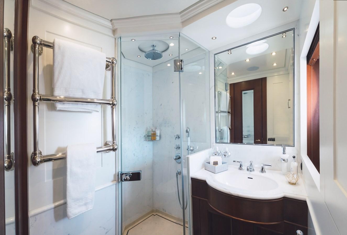 a bathroom with a shower and sink aboard MIKHAIL S. VORONTSOV Yacht for Sale