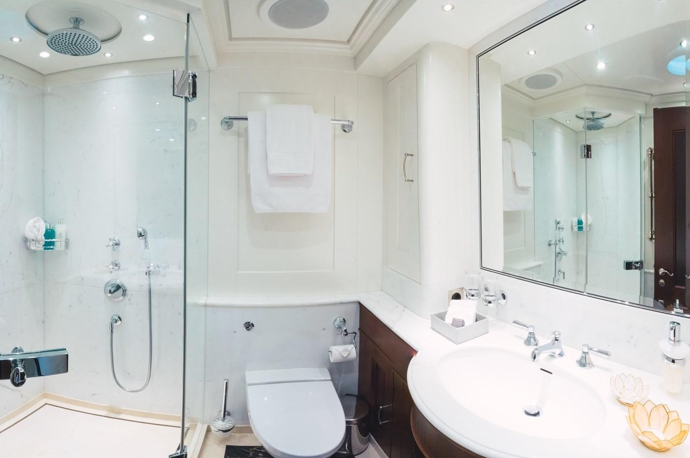 a bathroom with a shower sink and toilet aboard MIKHAIL S. VORONTSOV Yacht for Sale