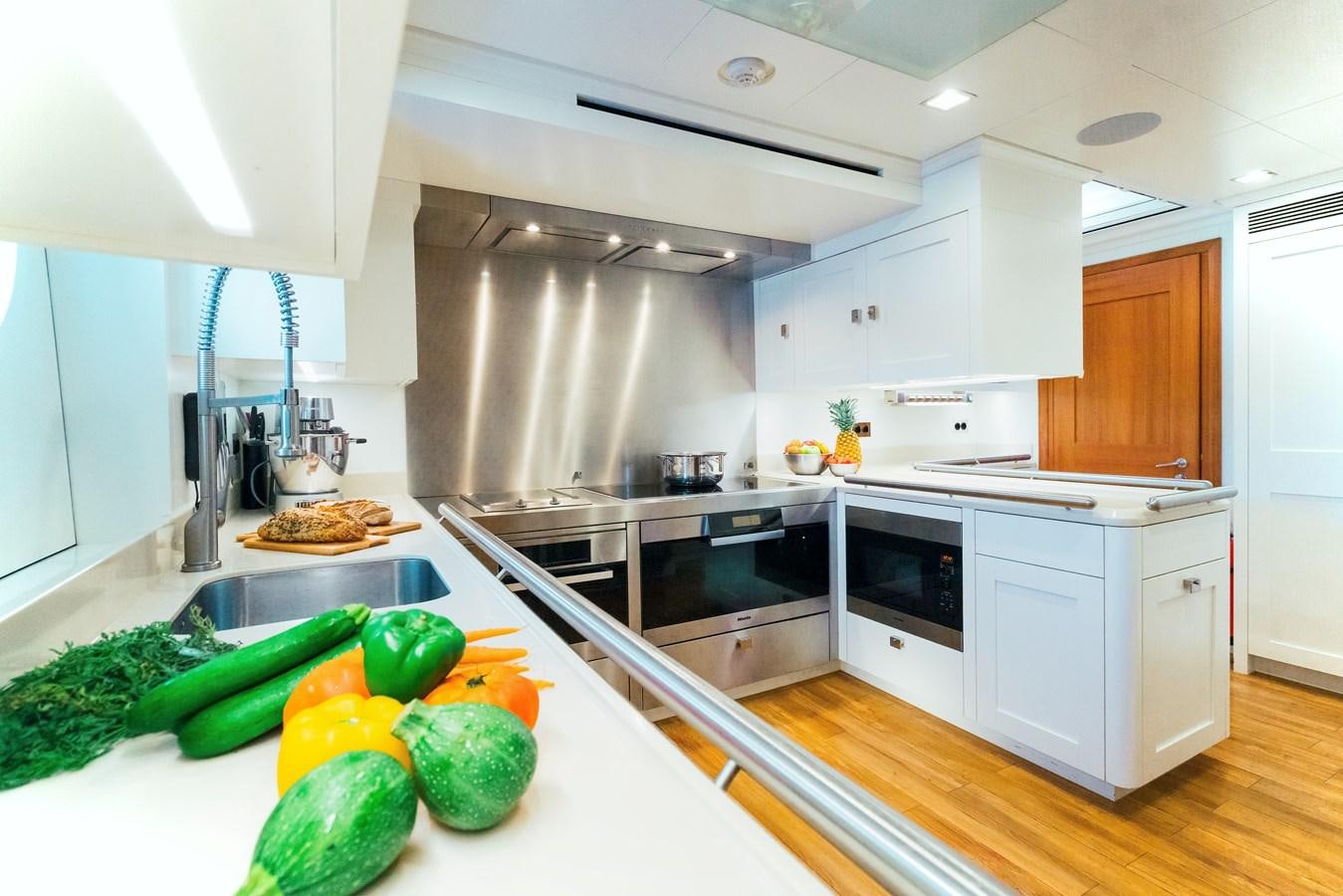 a kitchen with a large island aboard MIKHAIL S. VORONTSOV Yacht for Sale