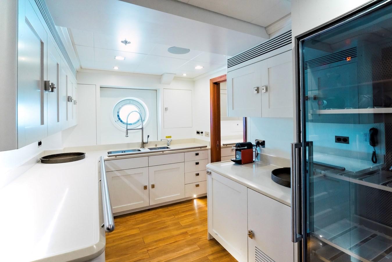 a kitchen with a glass door aboard MIKHAIL S. VORONTSOV Yacht for Sale