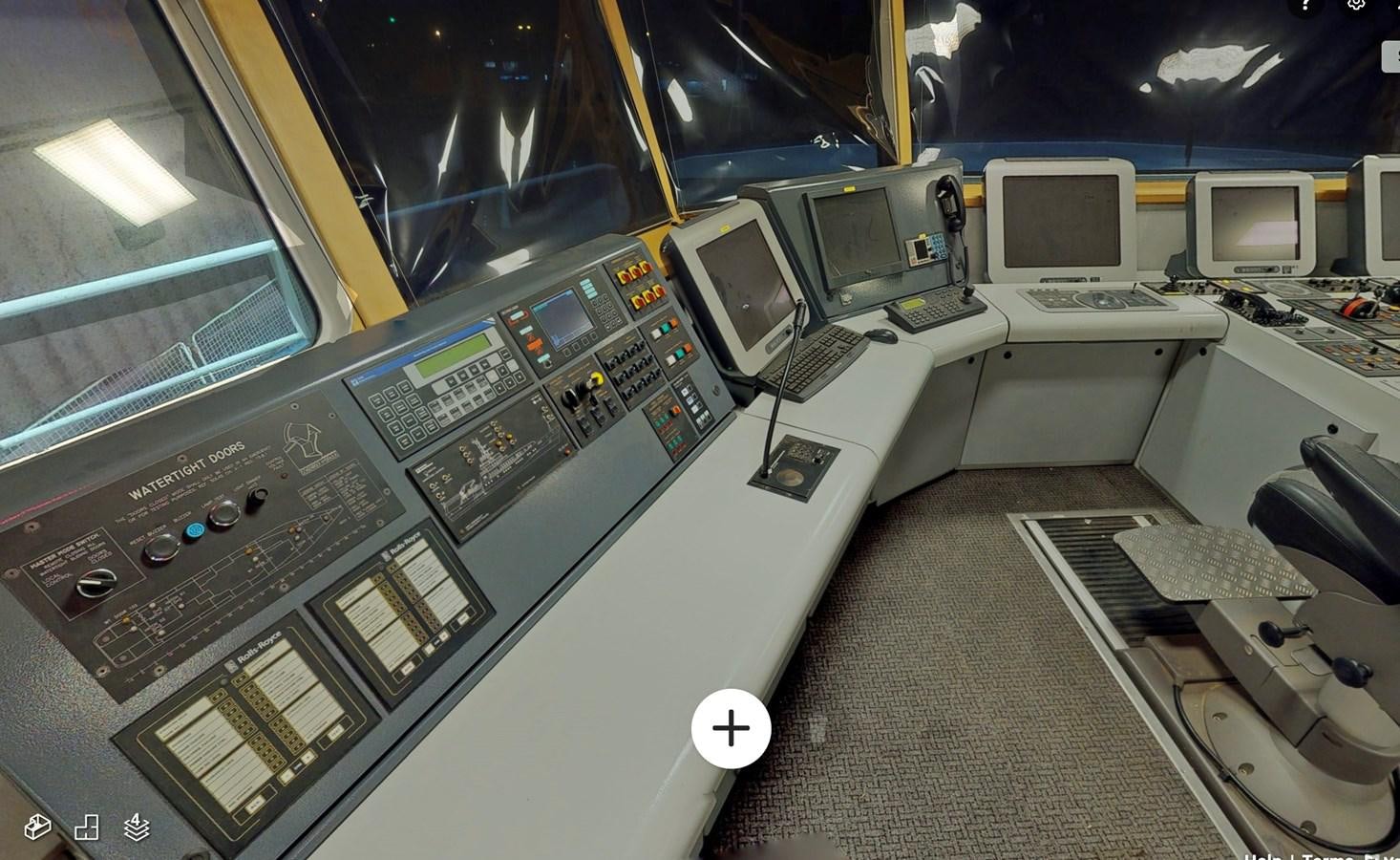 a room with computers and monitors aboard OCEAN XPLORER 71 Yacht for Sale