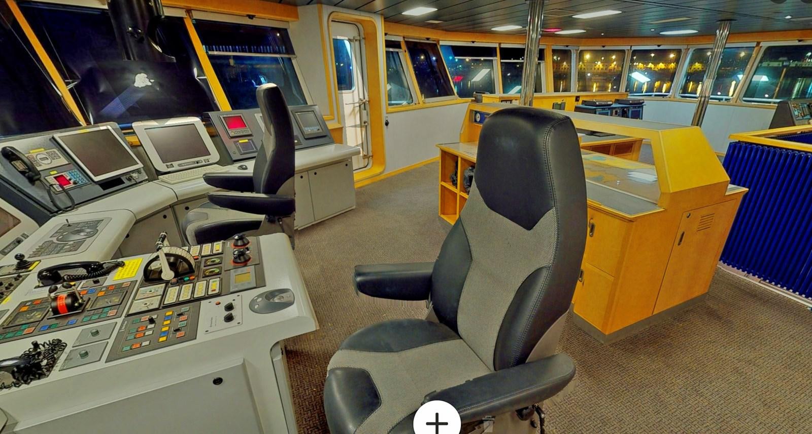 an office with a desk and chairs aboard OCEAN XPLORER 71 Yacht for Sale