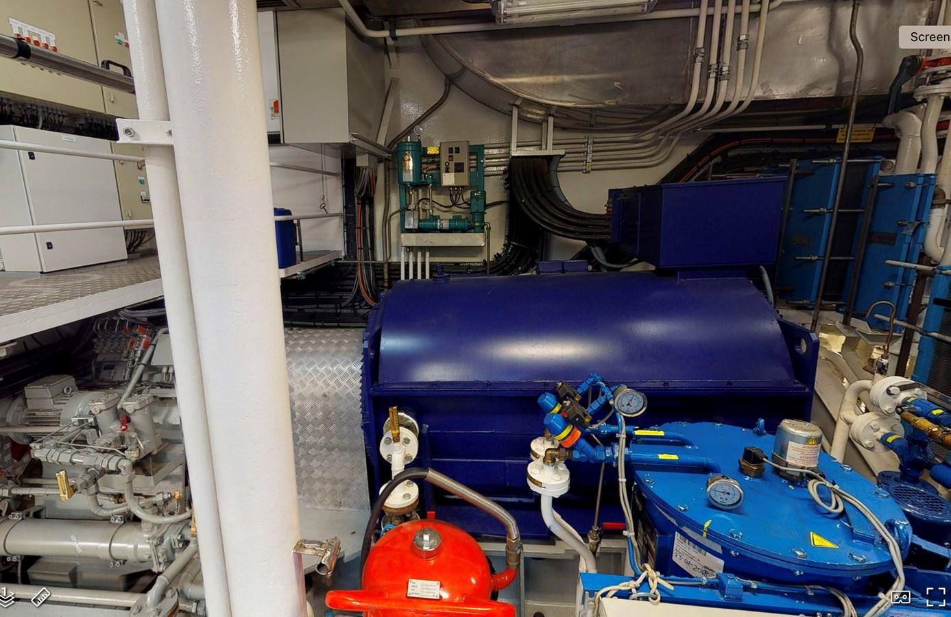 a blue machine in a room aboard OCEAN XPLORER 71 Yacht for Sale