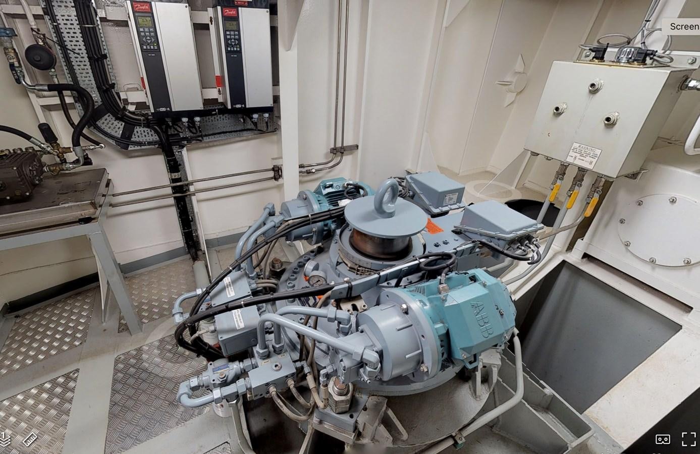 a machine with a large metal cylinder aboard OCEAN XPLORER 71 Yacht for Sale