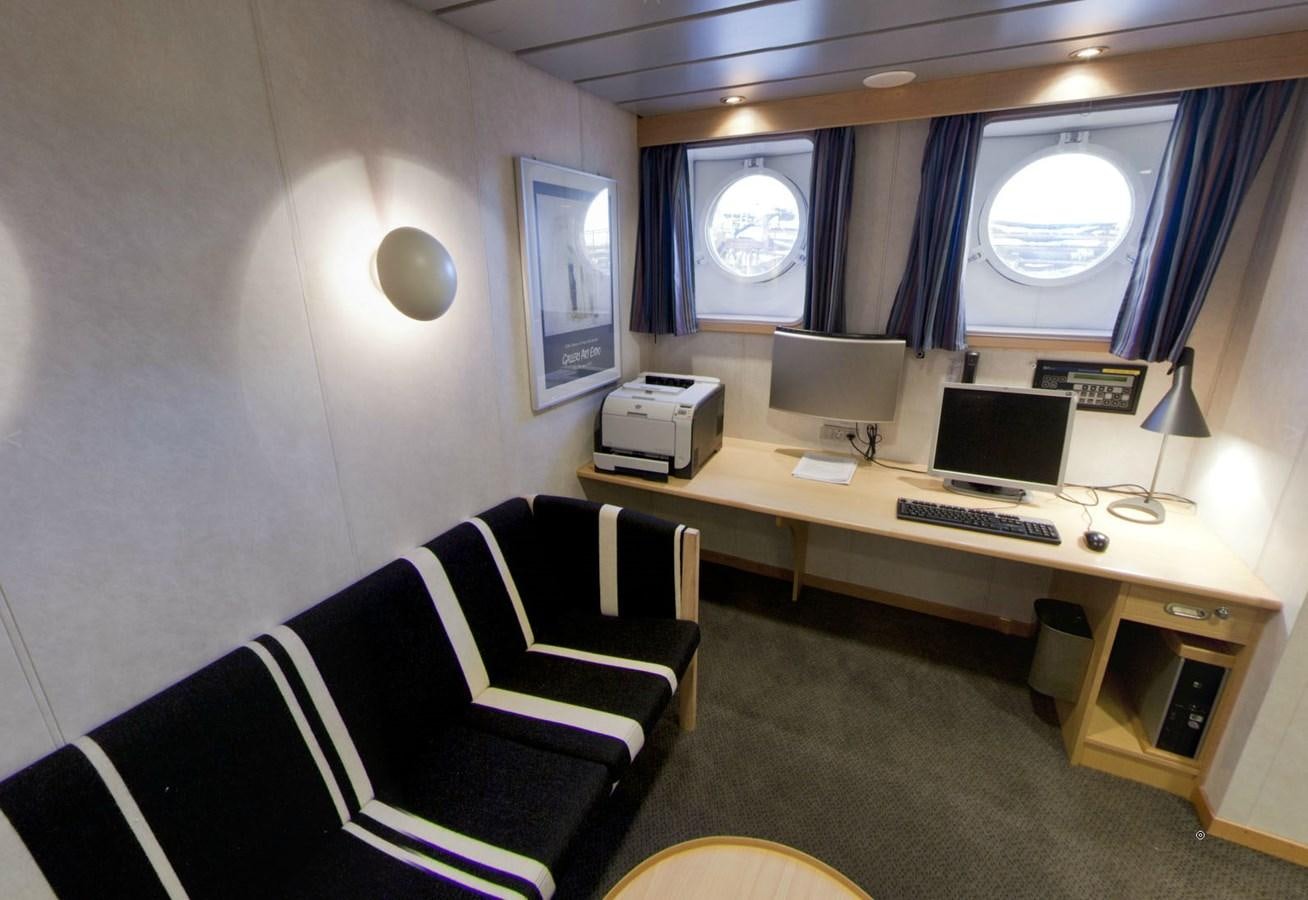 a room with a desk and a computer aboard OCEAN XPLORER 71 Yacht for Sale
