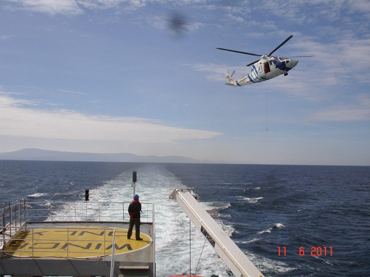 a helicopter flying over a body of water aboard OCEAN XPLORER 71 Yacht for Sale