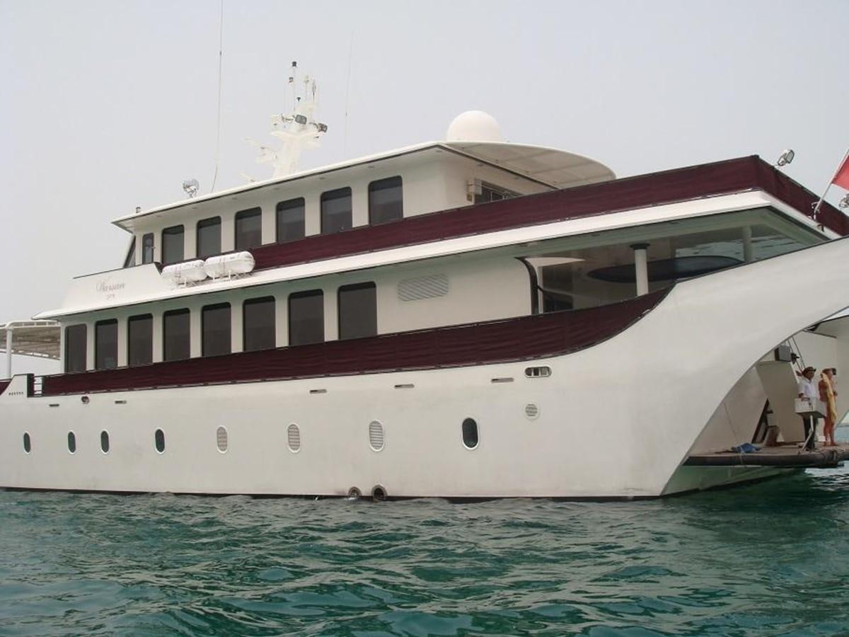 a large white boat in the water aboard WARSAN Yacht for Sale