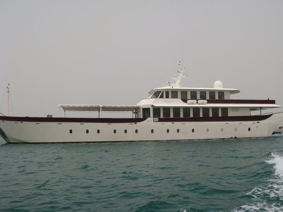 a large white boat in the water aboard WARSAN Yacht for Sale
