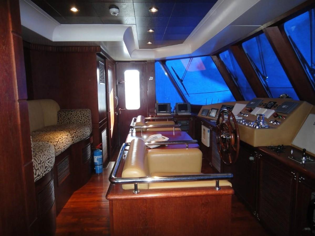 a room with a couch and a desk aboard WARSAN Yacht for Sale