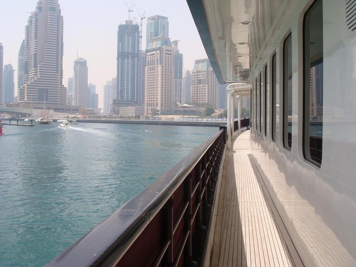 a body of water with buildings in the background aboard WARSAN Yacht for Sale