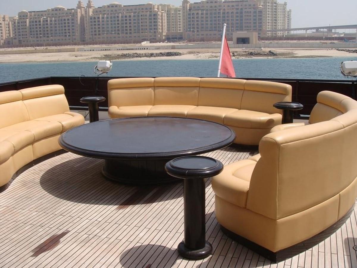 a table with chairs around it aboard WARSAN Yacht for Sale