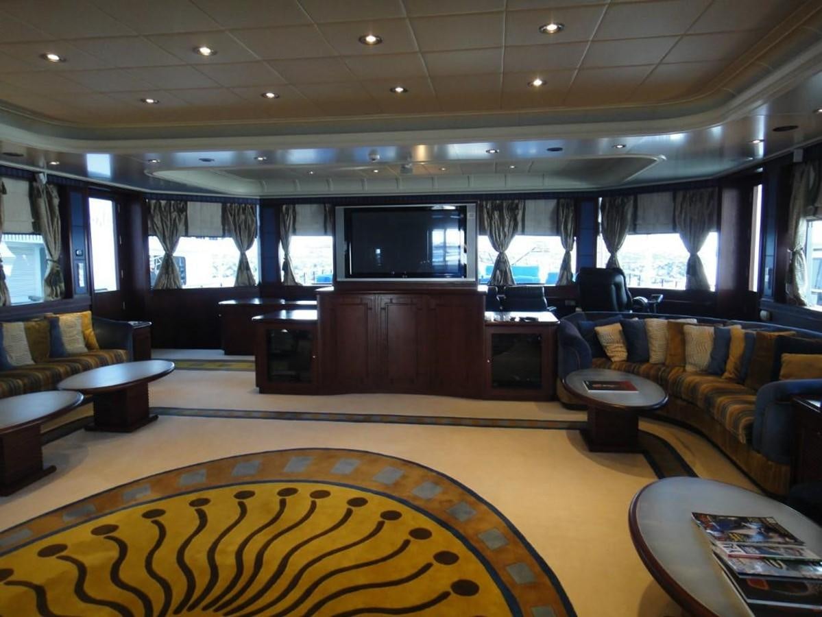 a large room with a couch and a tv aboard WARSAN Yacht for Sale