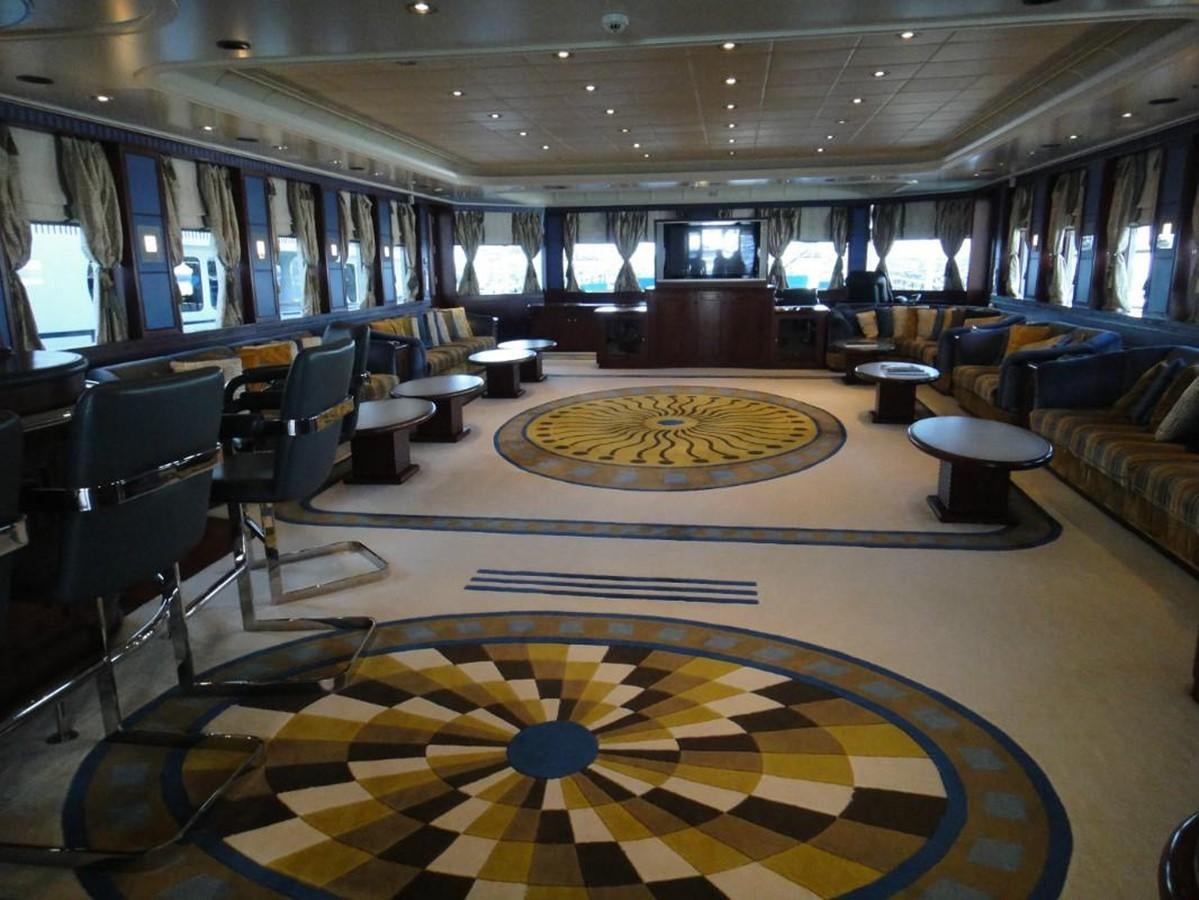 a room with a rug and chairs aboard WARSAN Yacht for Sale