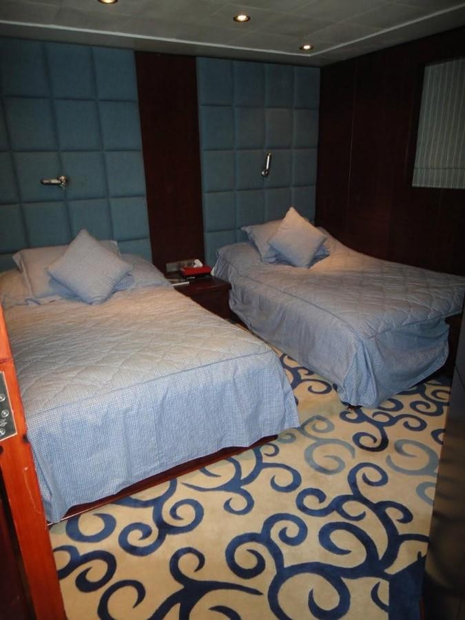 a bed in a room aboard WARSAN Yacht for Sale