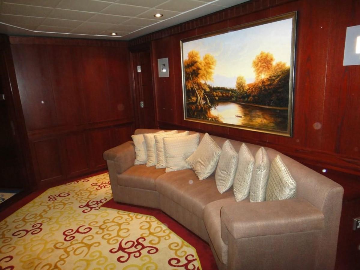 a living room with a large painting aboard WARSAN Yacht for Sale